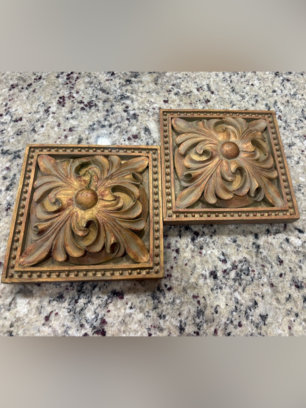 Set of 2 gold/brown heavy plaster wall decor in overall good condition